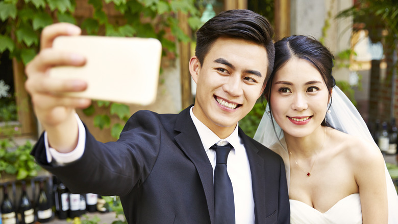 Bride and groom take a selfie 
