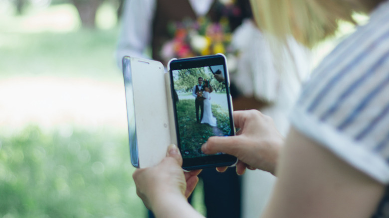 Wedding content creator taking video