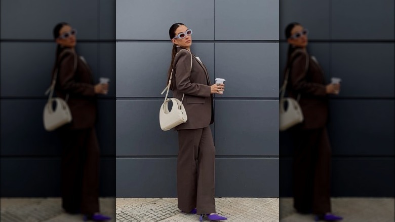 Woman wearing dark brown suit