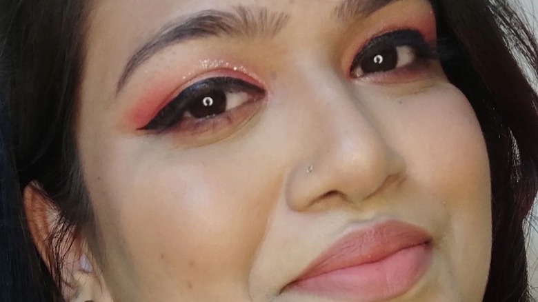 Girl wearing coral makeup 