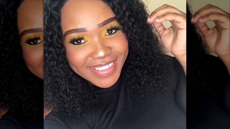 Girl wearing bold yellow eyeshadow.