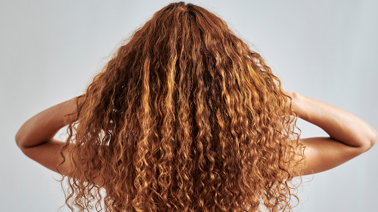 woman with flowing curly hair