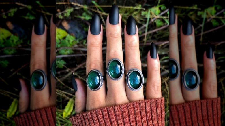 Mood rings and black matte nails