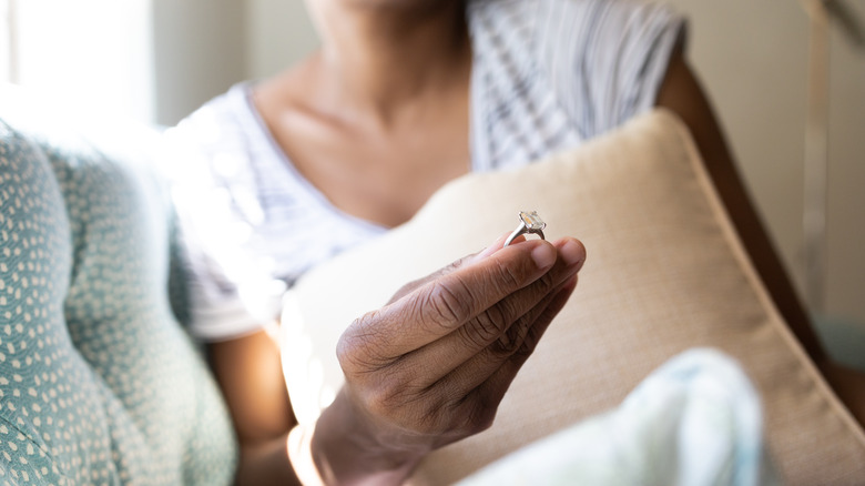 woman holding engagement ring 