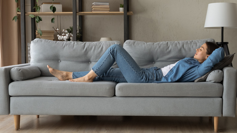woman lounging on sofa