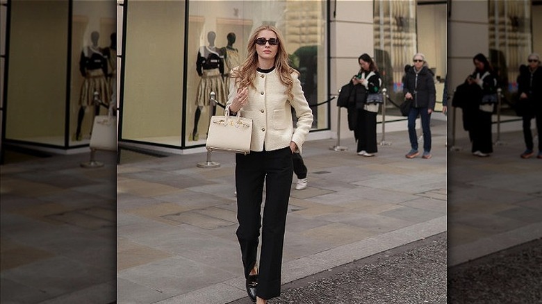 Woman carrying a Hermes Birkin bag