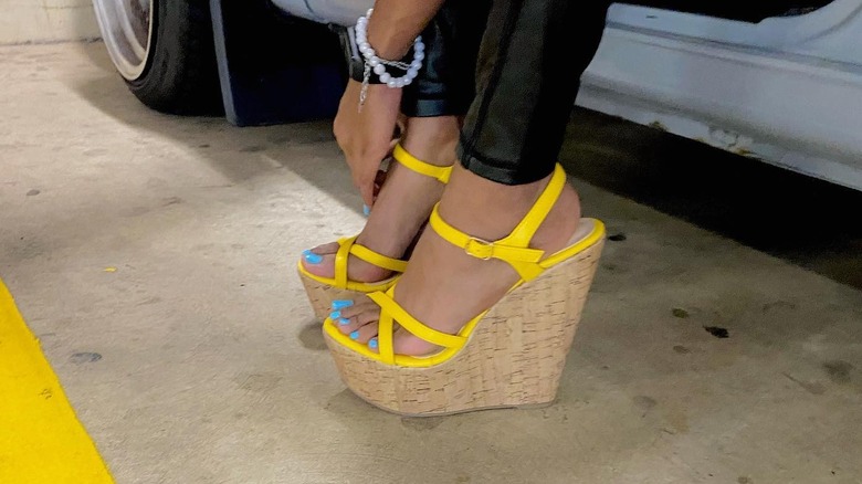 Blue pedicure and yellow wedges