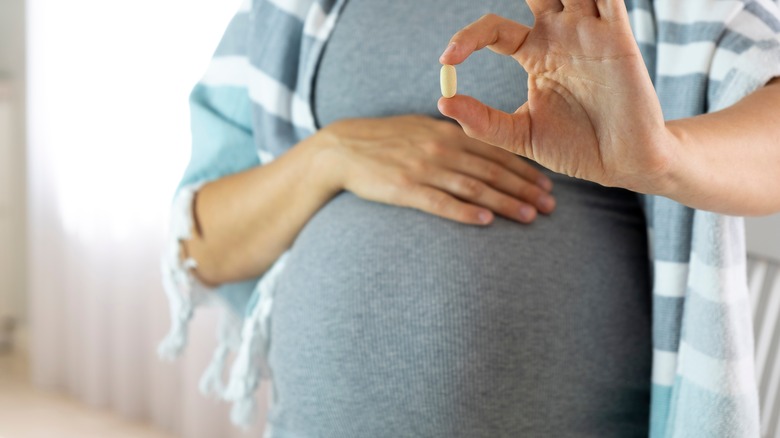 Pregnant woman with iron vitamin