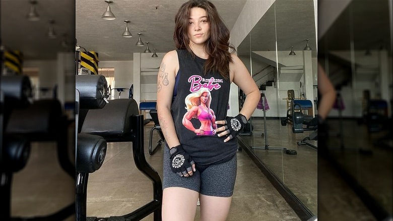 Woman poses in gym
