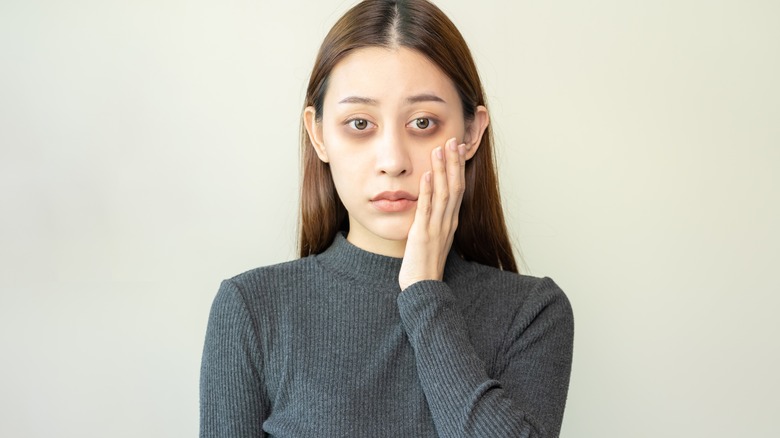 Woman stares blankly