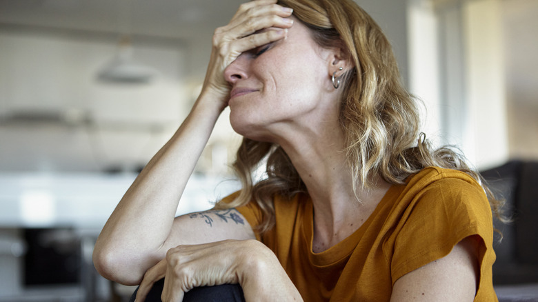 Distressed woman with blond hair 