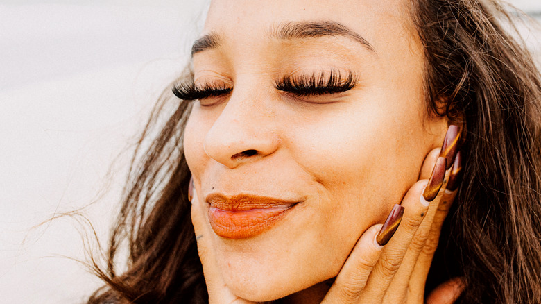 Woman smiling with long lashes