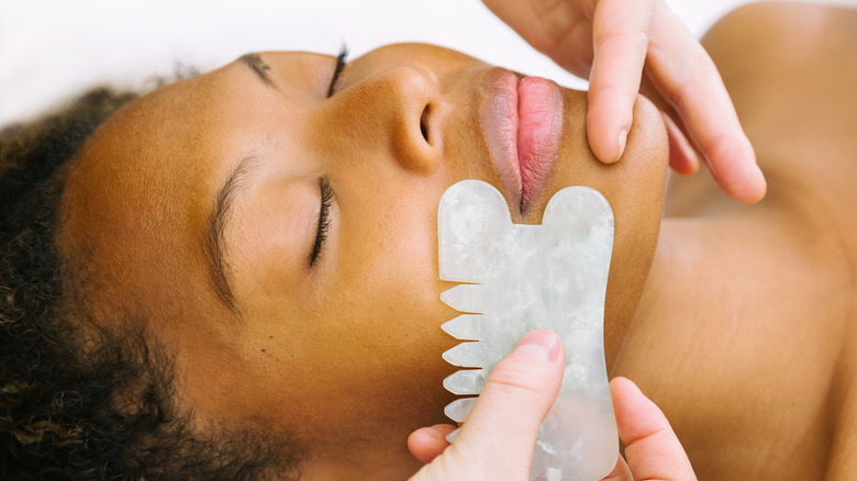 woman getting gua sha massage