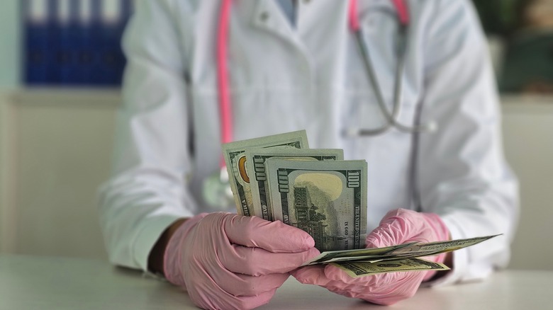 doctor counting money