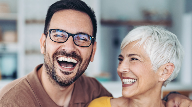 smiling man and older woman