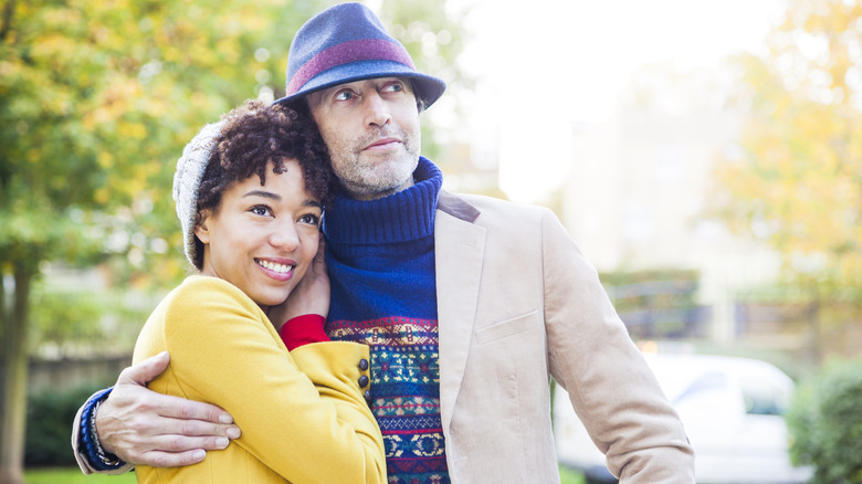 age-gap couple embracing