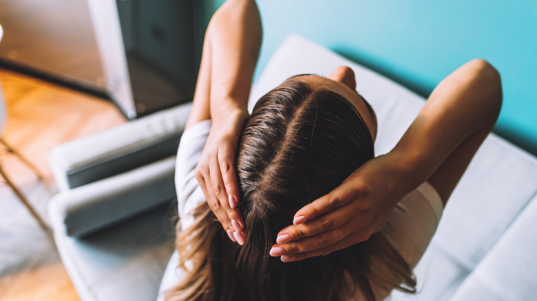 woman touching hair