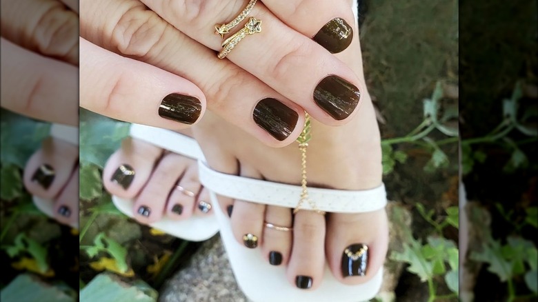 A dark brown pedicure