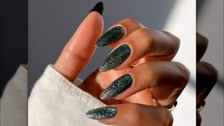 long glittery green almond nails 