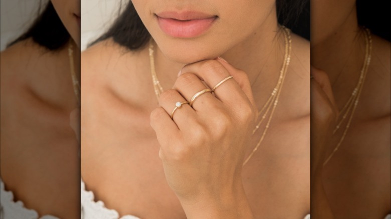 Girl wearing simple band rings