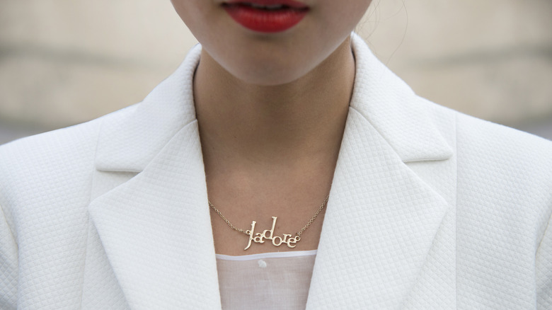 woman wearing j'adore nameplate necklace