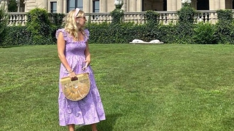 Woman posing in purple nap dress