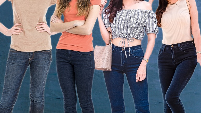 Four women wearing navy blue jeans