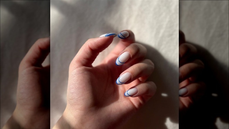 negative space french manicure in bold blue