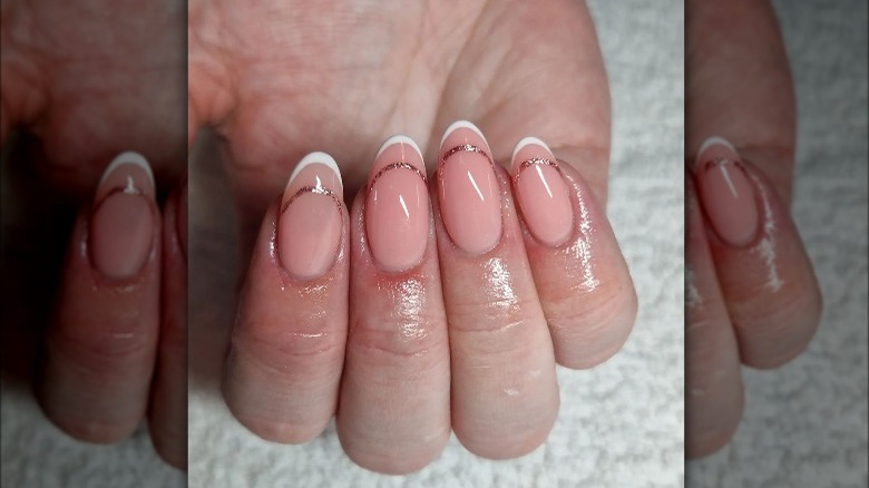 negative space French manicure in white and glitter