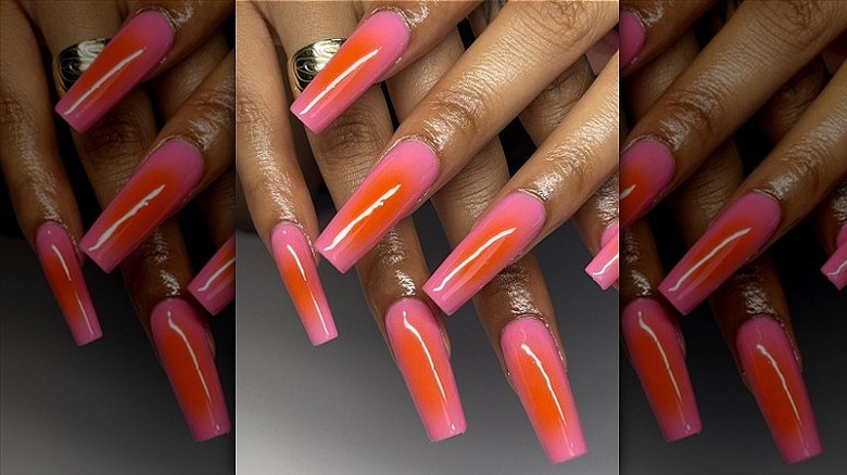 woman with orange and pink nails