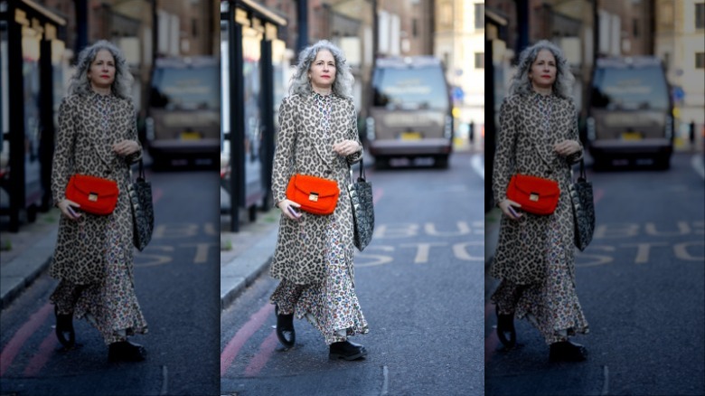 woman with neon red crossbody