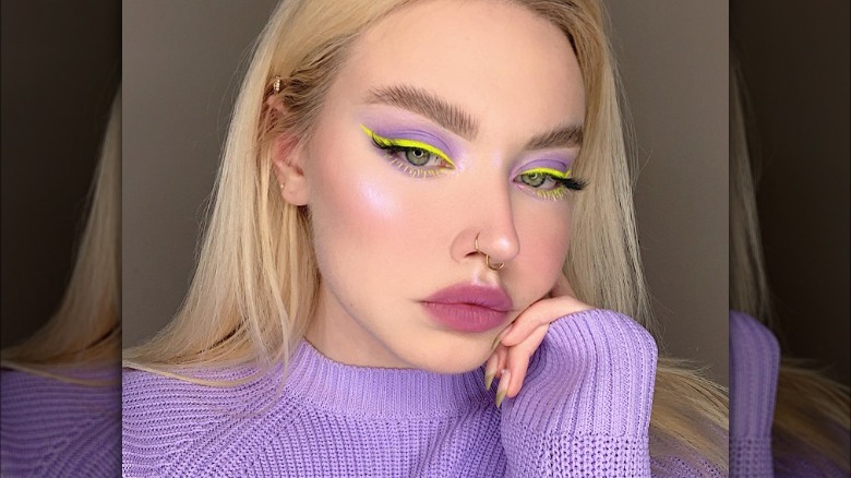 Neon yellow winged eyeliner