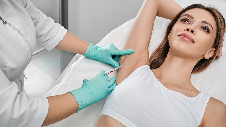 woman receiving Botox to underarm