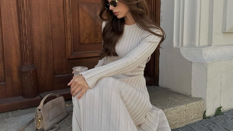 woman wearing cream knit dress