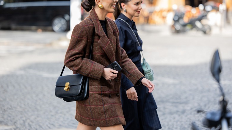 woman wearing brown coat