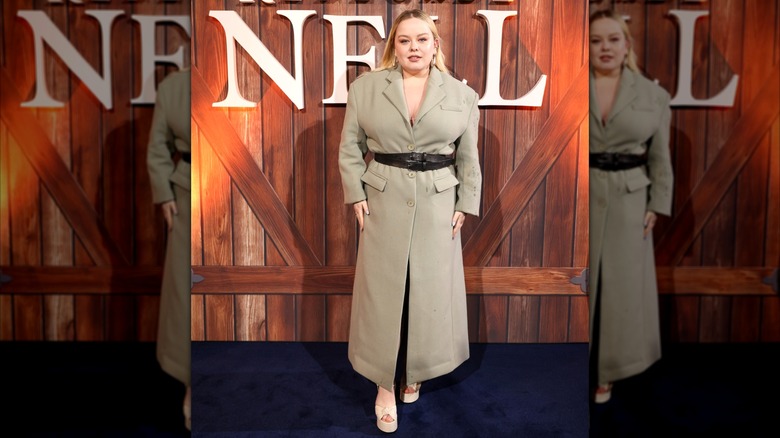 Nicola Coughlan wearing a trench dress at the premiere of "Renegade Nell."