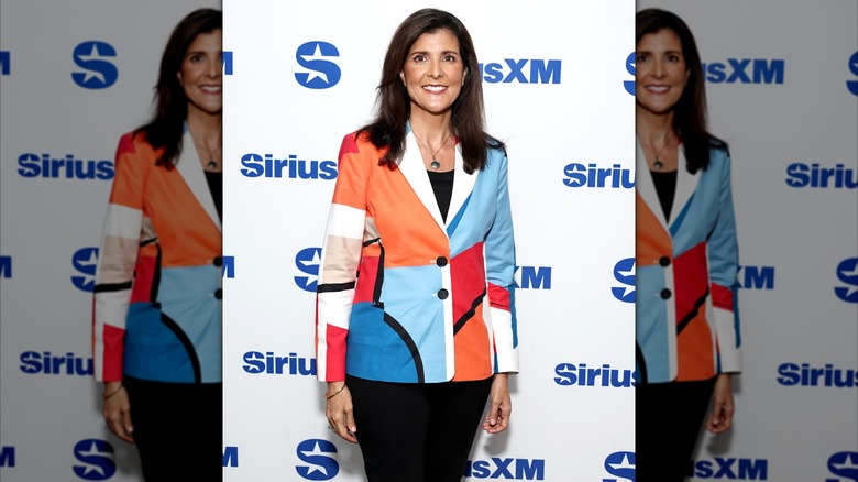 Nikki Haley wearing a bright, color-blocked blazer at SiriusXM.