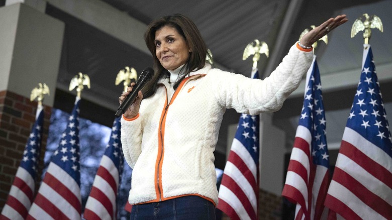 Nikki Haley wearing a Clemson University fleece jacket on stage.