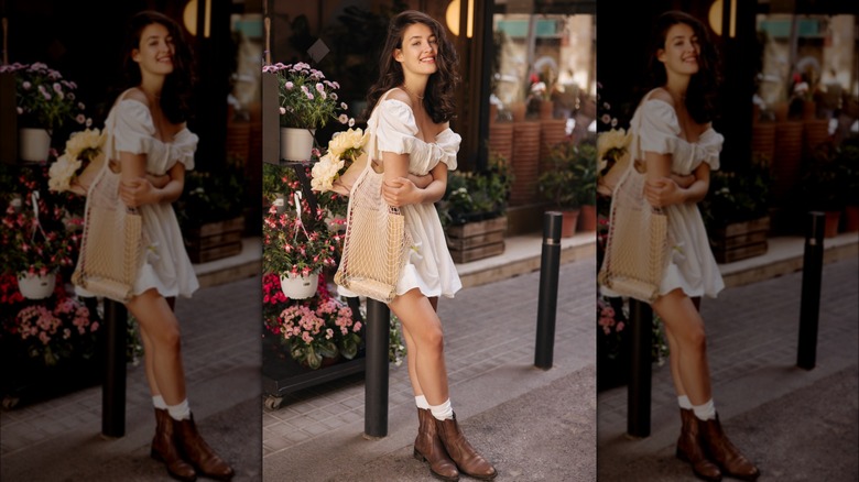 Girl wearing white sundress, boots