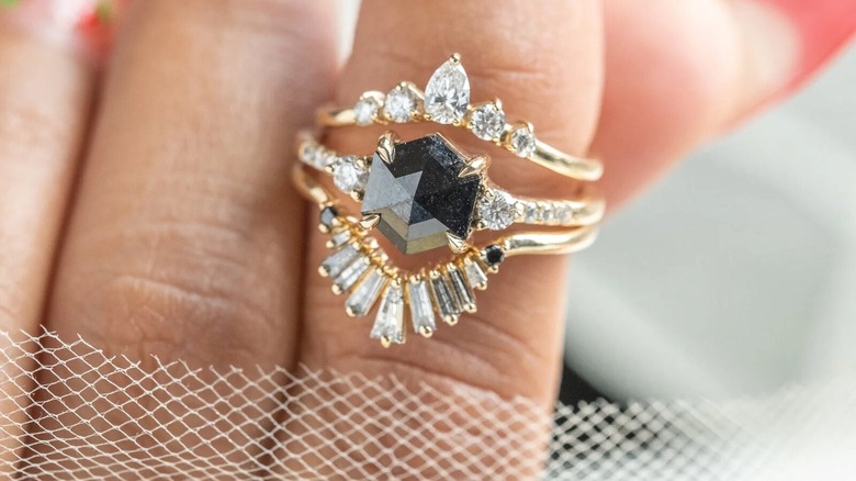 Black diamond engagement ring with gold band