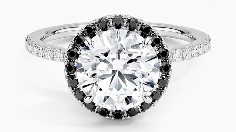 Black halo of diamonds on an engagement ring