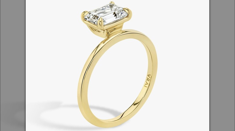 Engagement ring with off-center diamond