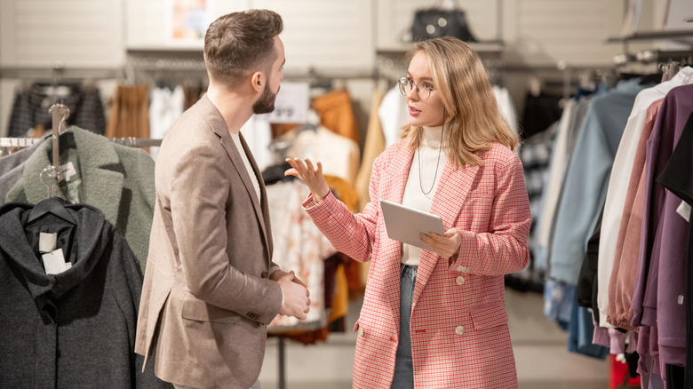 stylist talking to customer in store