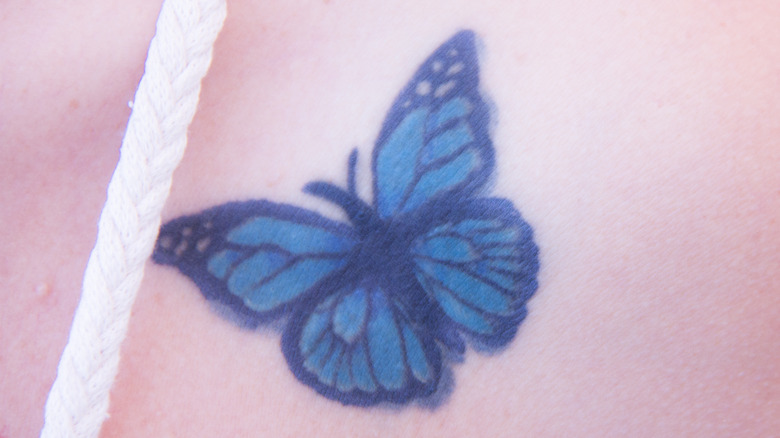 Blue butterfly tattoo