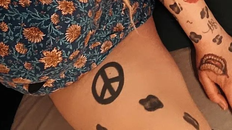 '70s peace sign tattoo