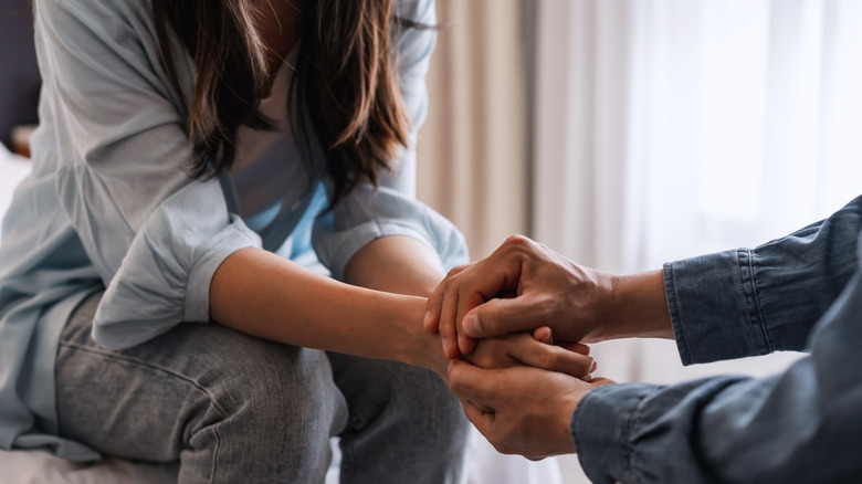 couple holding hands