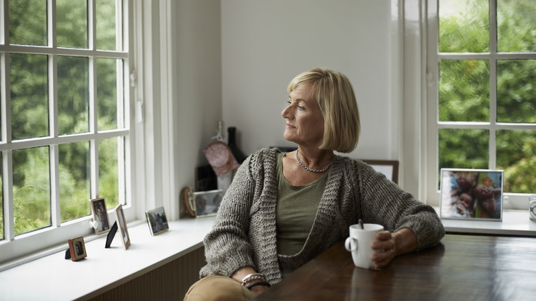 woman at table with coffee