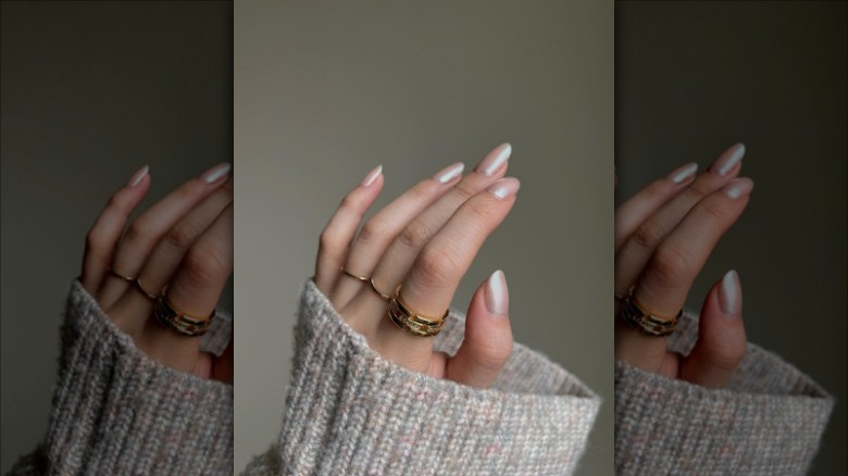 hand with nude chrome nails