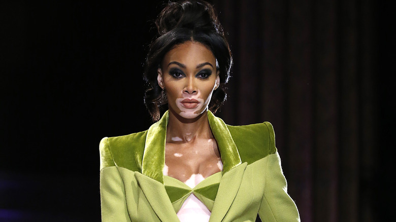 model Winnie Harlow on the runway with updo hairstyle