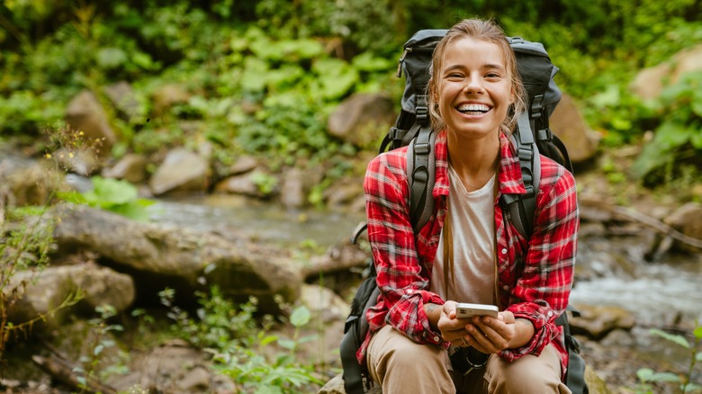 young woman smiling on a hike